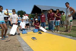 Photograph of students racing model solar cars.