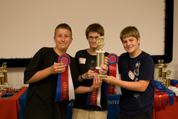 Photograph of  M-Jop III with trophy and ribbons.