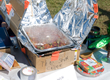 Photo of a student desinged and built solar oven.