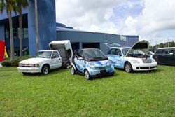 Photos of alternative fueled vehicles on lawn.