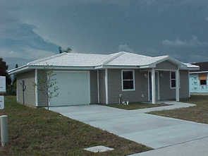 White s-tile roof home